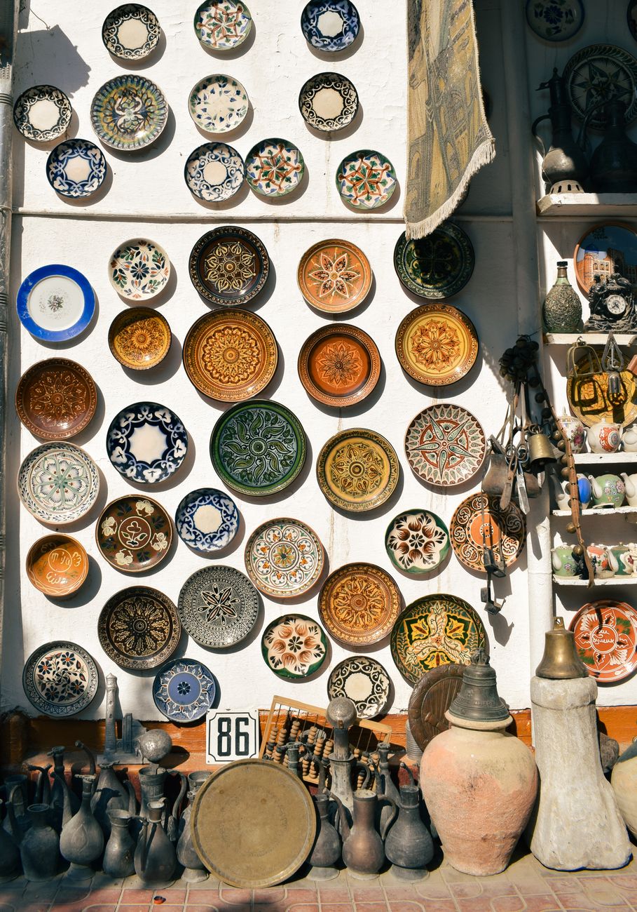 A vibrant display of traditional handcrafted pottery and ceramics in Bukhara, Uzbekistan