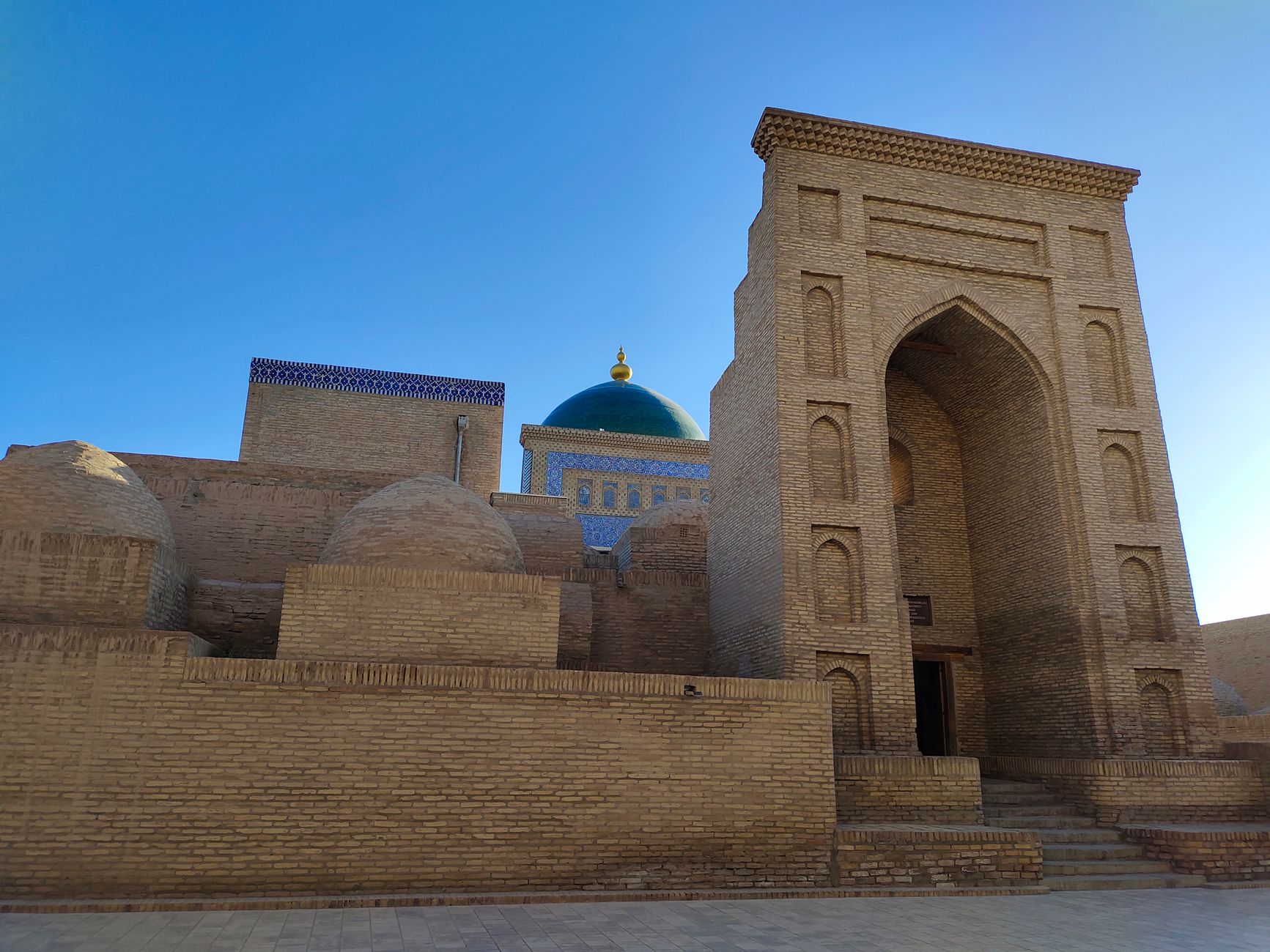 Ancient Islamic architecture with a blue dome in Khiva, Uzbekistan · Bukhara, Uzbekistan
