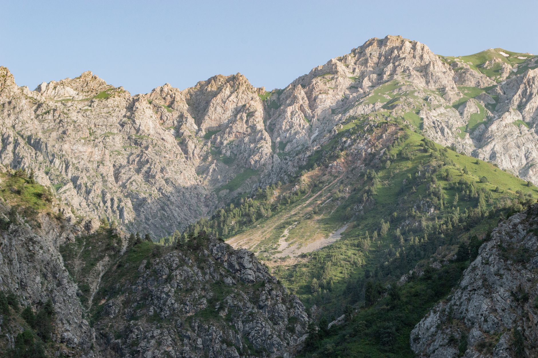 View of rugged mountains and lush greenery in Uzbekistan · Fergana Valley, Uzbekistan