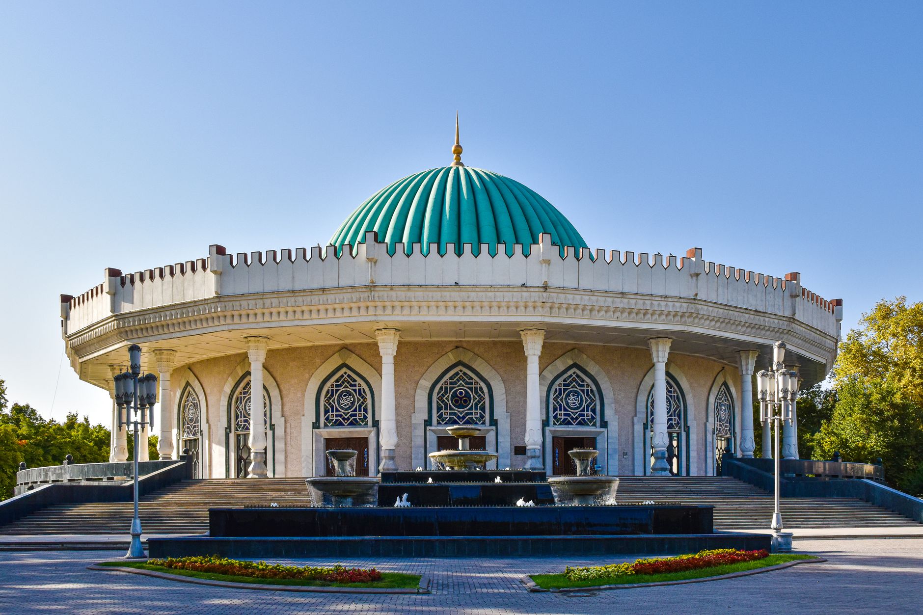 Exterior of the Amir Timur Museum featuring a striking turquoise dome in Tashkent, Uzbekistan