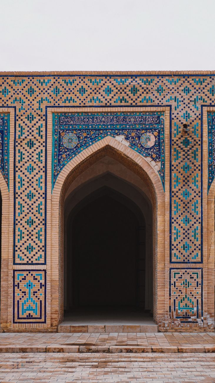 Stunning mosaic tile patterns on a historic Bukhara building, showcasing Islamic architecture · Uzbekistan, Uzbekistan